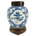 A Chinese blue and white ‘Antiques’ ovoid jar, Kangxi period, painted with four shaped reserves of