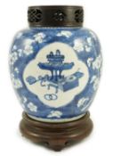 A Chinese blue and white ‘Antiques’ ovoid jar, Kangxi period, painted with four shaped reserves of