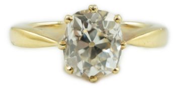 An 18k gold and oval cushion cut solitaire diamond ring, the stone weighing approximately 1.20ct,