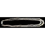 A twin strand graduated cultured pearl necklace, with gold and six stone diamond set rectangular