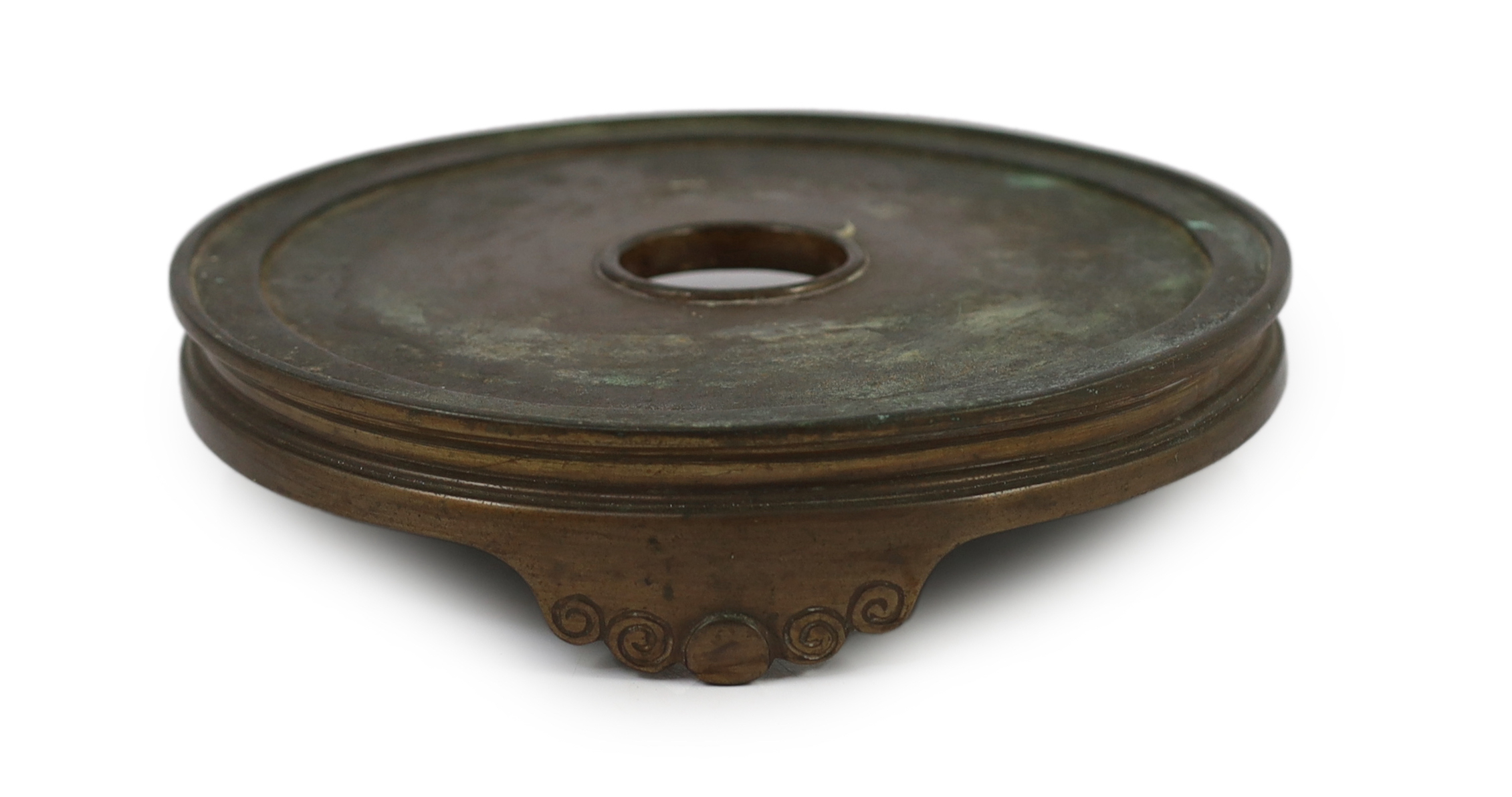 A large Chinese patinated bronze censer stand, 17th/18th century, the disc shaped top supported on