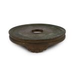 A large Chinese patinated bronze censer stand, 17th/18th century, the disc shaped top supported on