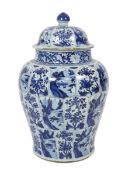 A massive Chinese blue and white jar and cover, Kangxi period, painted with alternating landscape