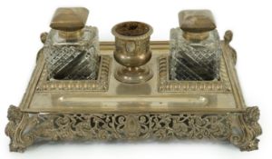 An ornate Edwardian silver rectangular inkstand, by Mappin & Webb, with two mounted glass wells