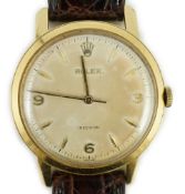 A gentleman's early 1950's Rolex manual wind wrist watch, with baton and quarterly Arabic