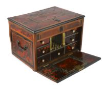 An early 18th century Indo Portuguese ebony, satinwood and red tortoiseshell travelling case, the