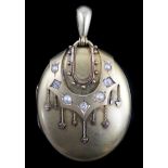 A Victorian gold, diamond and split pearl set oval locket, with tassel drop applied decoration, 6cm,