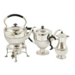 An Edwardian demi-fluted silver tea kettle on stand with burner, with matching pedestal coffee pot
