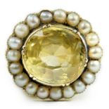 A 19th century style gold and round cut single stone yellow sapphire set dress ring, with split
