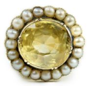 A 19th century style gold and round cut single stone yellow sapphire set dress ring, with split