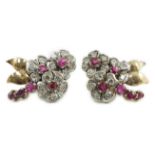 A pair of 1950's gold ruby and diamond set triple flower head cluster earrings, 24mm, gross weight