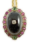A gold, cabochon garnet, emerald, ruby and diamond cluster set oval pendant, 33mm, on a gilt chain