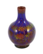 A Pilkingtons Royal Lancastrian copper lustre bottle vase, by Gordon M. Forsyth, decorated with