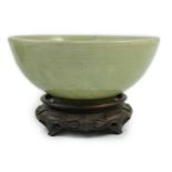 A Chinese Ming Longquan celadon bowl, 15th century, the interior moulded to the centre with a flower