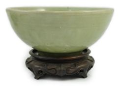 A Chinese Ming Longquan celadon bowl, 15th century, the interior moulded to the centre with a flower