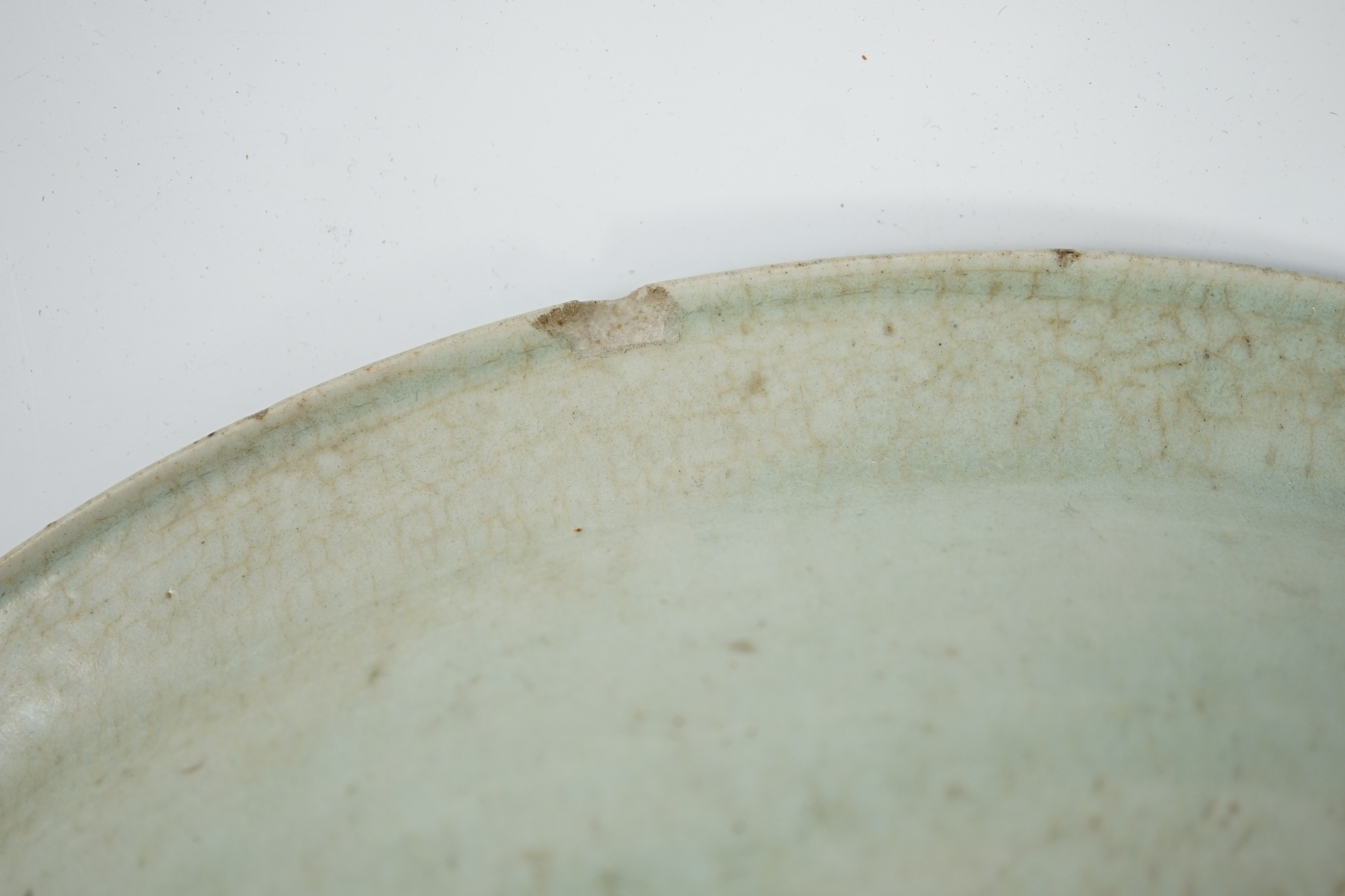 A Chinese Longquan celadon dish, Yuan-Ming dynasty, 13th/14th century, covered in a pale sea green - Image 7 of 10