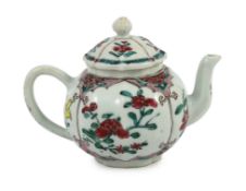 A Chinese famille rose petal lobed teapot, Yongzheng period, painted with panels of pinkish red