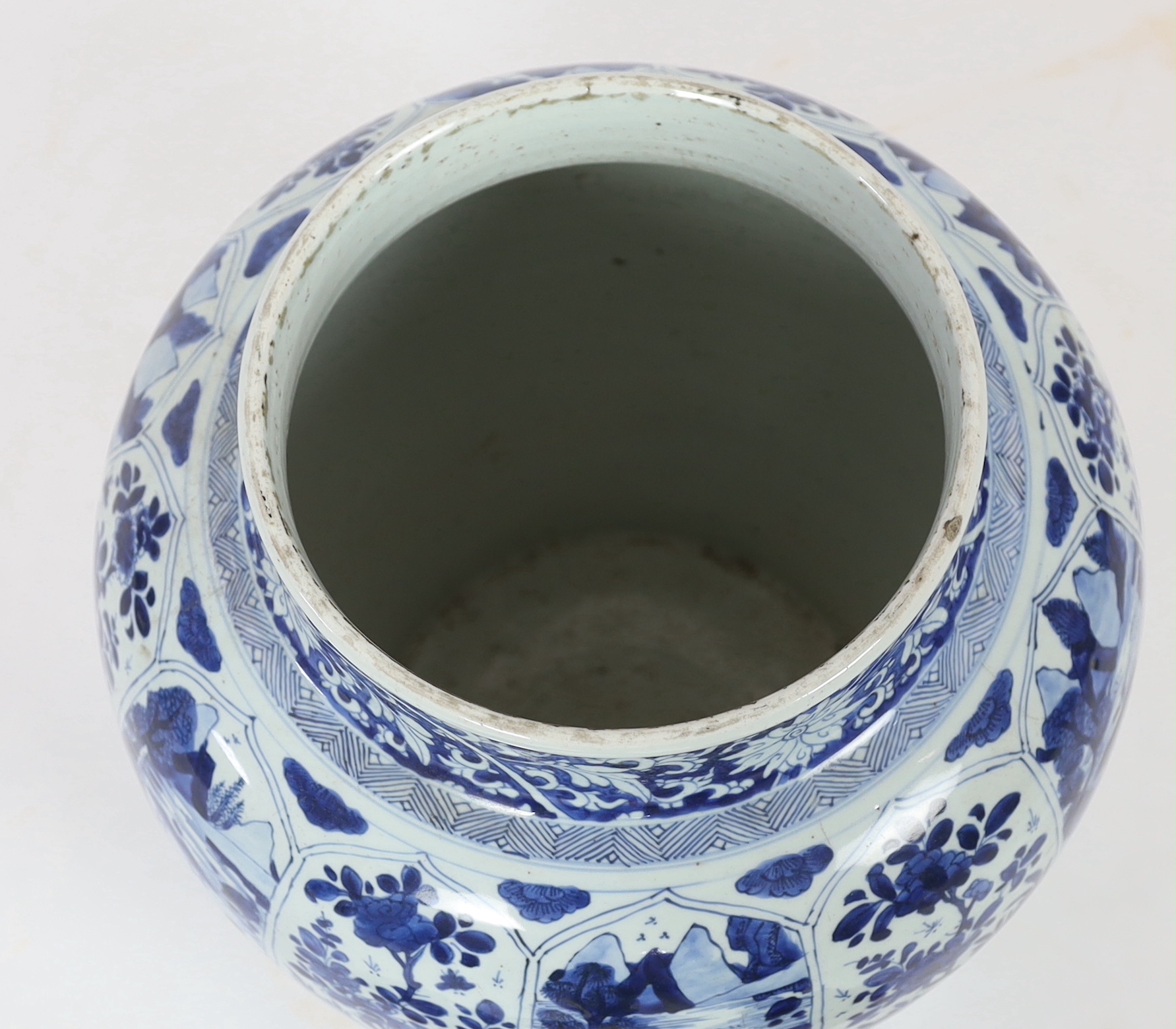 A massive Chinese blue and white jar and cover, Kangxi period, painted with alternating landscape - Image 4 of 5