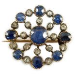 A Belle Epoque gold and silver, sapphire and diamond cluster set circular brooch, with a