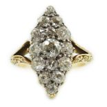 An early to mid 20th century 18ct gold and fifteen stone diamond cluster set marquise shaped ring,