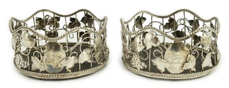 A pair of George III silver mounted wine coasters, by William Plummer, with wavy rope twist