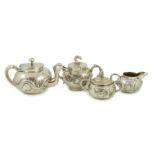 A Chinese three piece silver bachelor's tea set, by TC, decorated with dragon and one other