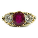 A Victorian style 18ct gold single stone oval cut ruby and two stone round cut diamond set ring,
