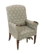 A late Victorian Howard & Sons armchair, upholstered in the original Howard & Sons floral scroll