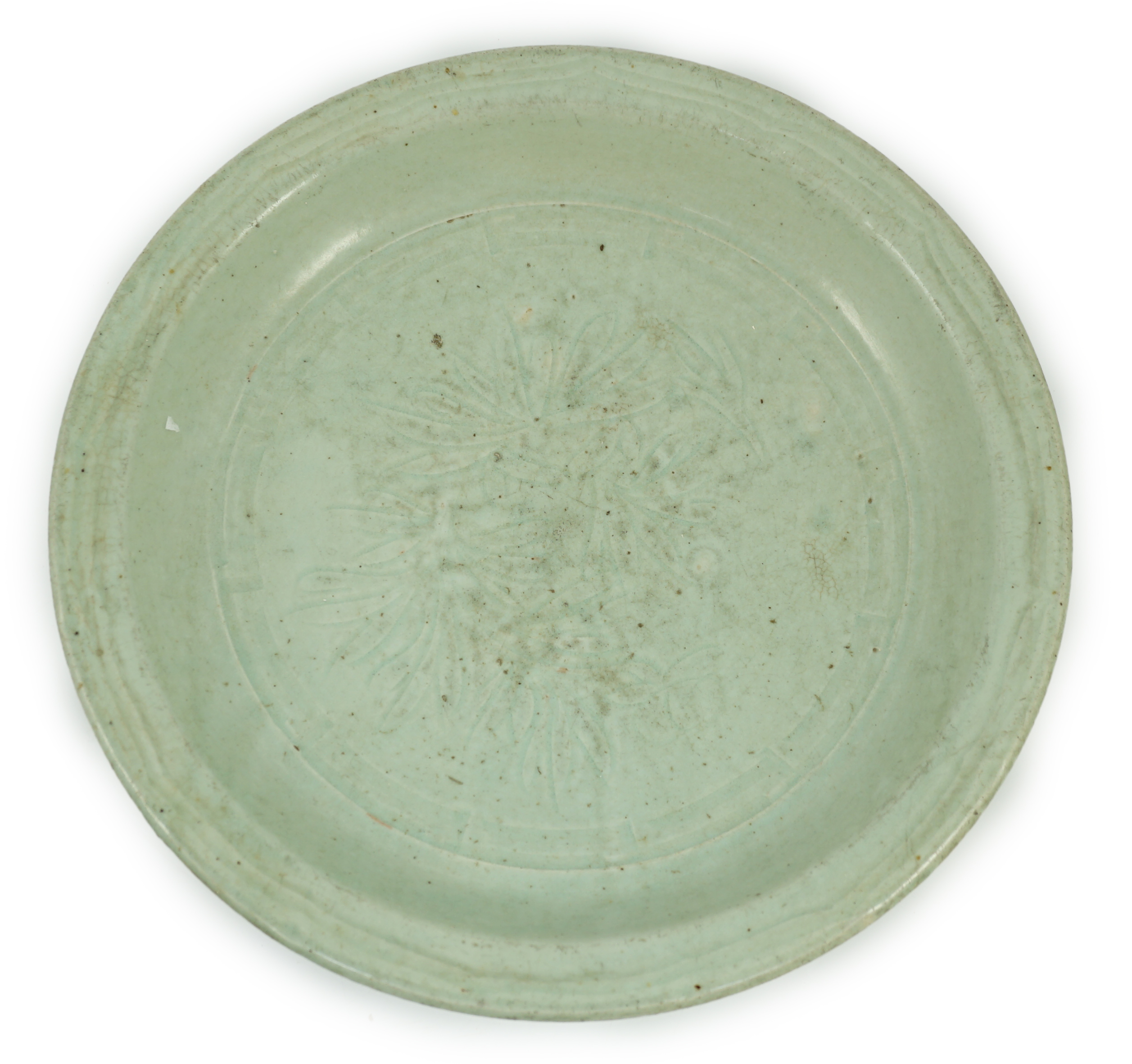 A Chinese Longquan celadon dish, Yuan-Ming dynasty, 13th/14th century, covered in a pale sea green