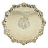 An early George II silver salver, by Ebenezer Coker, of shaped circular form, with shell and