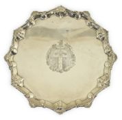 An early George II silver salver, by Ebenezer Coker, of shaped circular form, with shell and