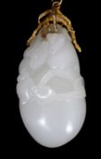 A Chinese white jade ‘conch shell’ yellow metal mounted pendant, the pendant carved with a large