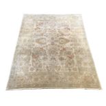 A large Indian ivory ground carpet, 445 x 372cm***CONDITION REPORT***Good condition but will benefit