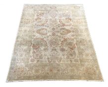 A large Indian ivory ground carpet, 445 x 372cm***CONDITION REPORT***Good condition but will benefit