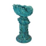 An impressive Burmantofts turquoise glazed faience ‘giant shell’ jardiniere and stand, c.1900, the