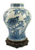 A Chinese blue and white ‘birds and blossom’ baluster vase, Kangxi period, painted with a continuous