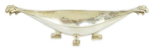 A George V Arts & Crafts planished silver boat shaped dish, by Omar Ramsden, with fluted