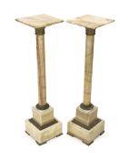 A pair of early 20th century French ormolu mounted onyx pedestals, with revolving square tops, width