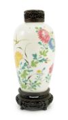 A Chinese famille rose ovoid vase, Yongzheng period, painted with chrysanthemums, peonies, a