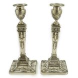 A pair of Elizabeth II Adam style silver candlesticks, by Barker Ellis Silver Co, on square bases,