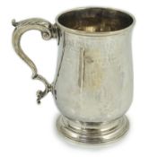 A George III silver baluster mug, by Thomas Wallis I, with acanthus leaf capped s-scroll handle,