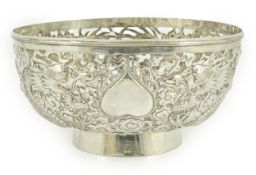 An early 20th century Chinese pierced silver circular bowl, decorated with dragons, character