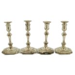 A matched set of four Victorian and later silver candlesticks, by Hawksworth, Eyre & Co Ltd, with
