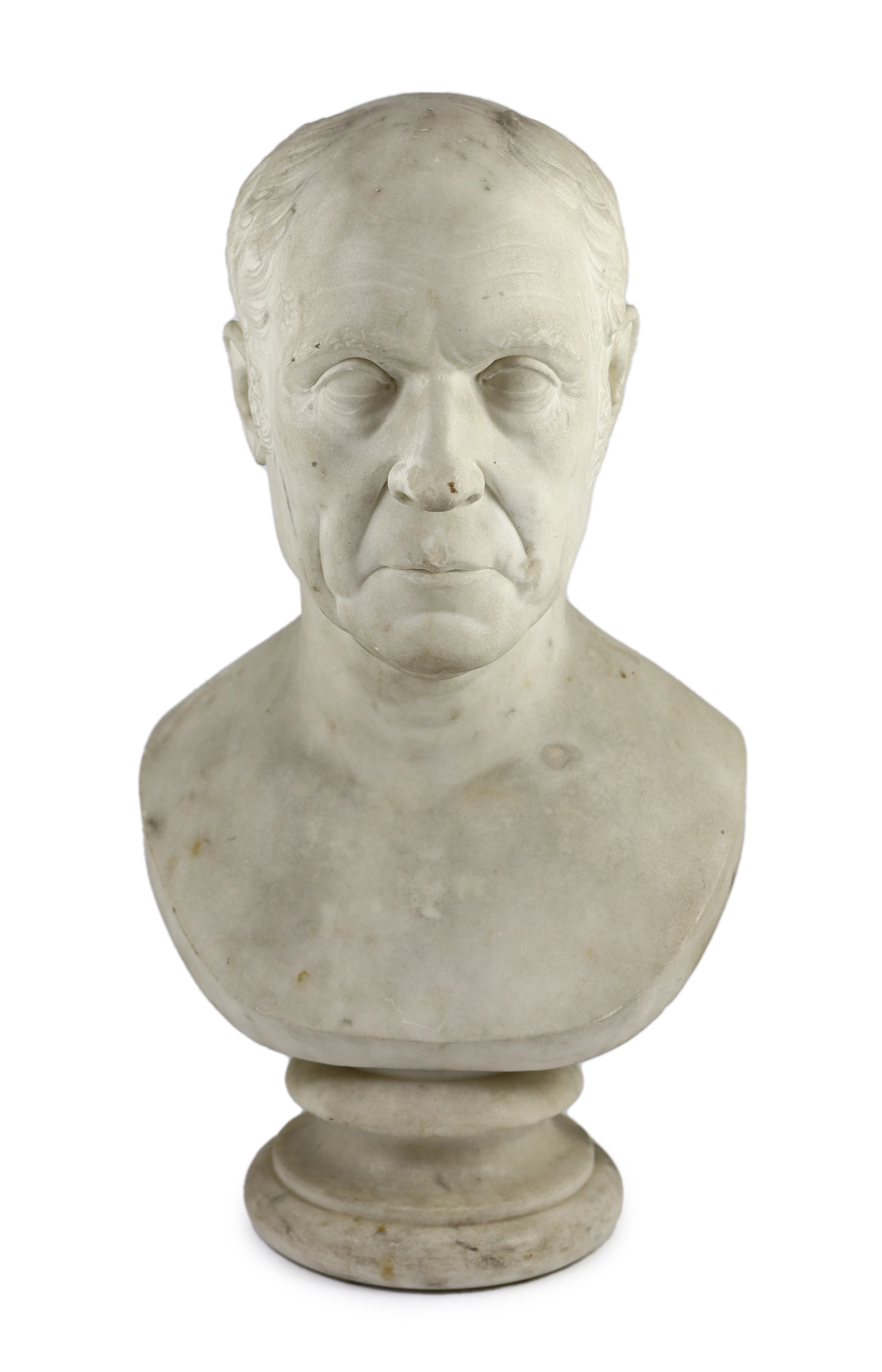 A carved white marble bust of a gentleman, second quarter 19th century, on a turned socle, 30cm