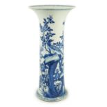 A tall Chinese blue and white ‘pheasants and rocks’ beaker vase, gu, Kangxi period, painted with