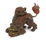 A large Japanese gilt and red lacquered bronze ‘shi-shi’ koro and cover, Edo period, boldly modelled