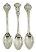 A cased set of three George V Arts & Crafts planished silver spoons by Omar Ramsden, with floral
