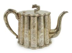 A late 19th/early 20th century Chinese Export silver teapot, by Luen Wo, Shanghai, of lobed oval