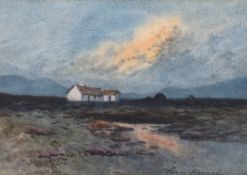 William Percy French (Irish, 1854-1920) Cottages in a landscape at sunsetwatercoloursigned in