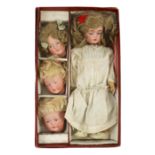 A rare J. D. Kestner bisque character doll, with three interchangeable character heads, German,